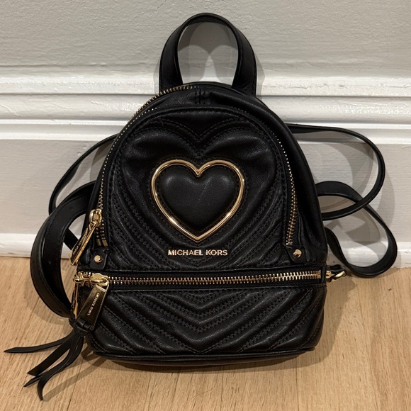 Michael Kors Handbags - Michael Kors Quilted Black Backpack with Gold Heart Detail